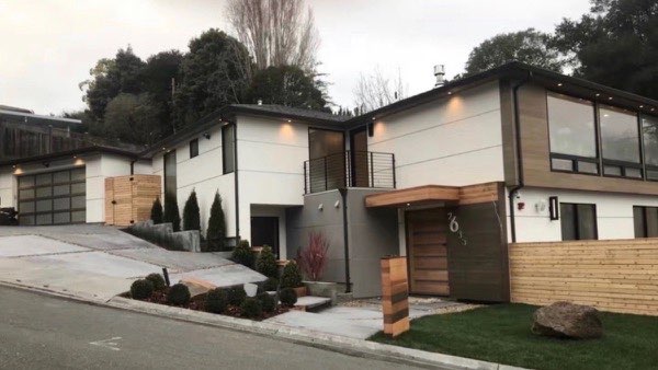 Modern home exterior with cedar accent walls and minimalist landscaping
