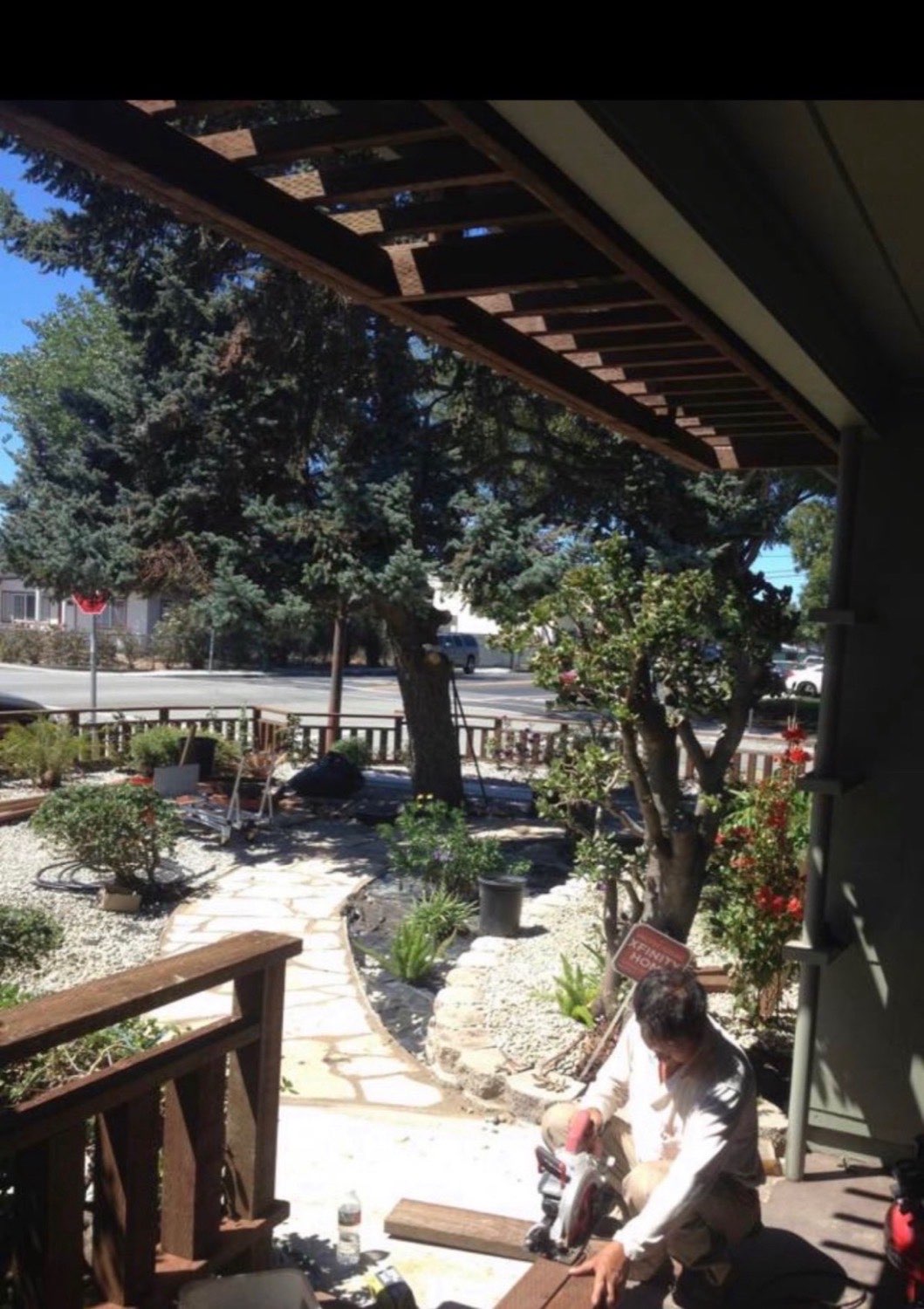 Professional land grading and pergola construction with flagstone pathway in front yard